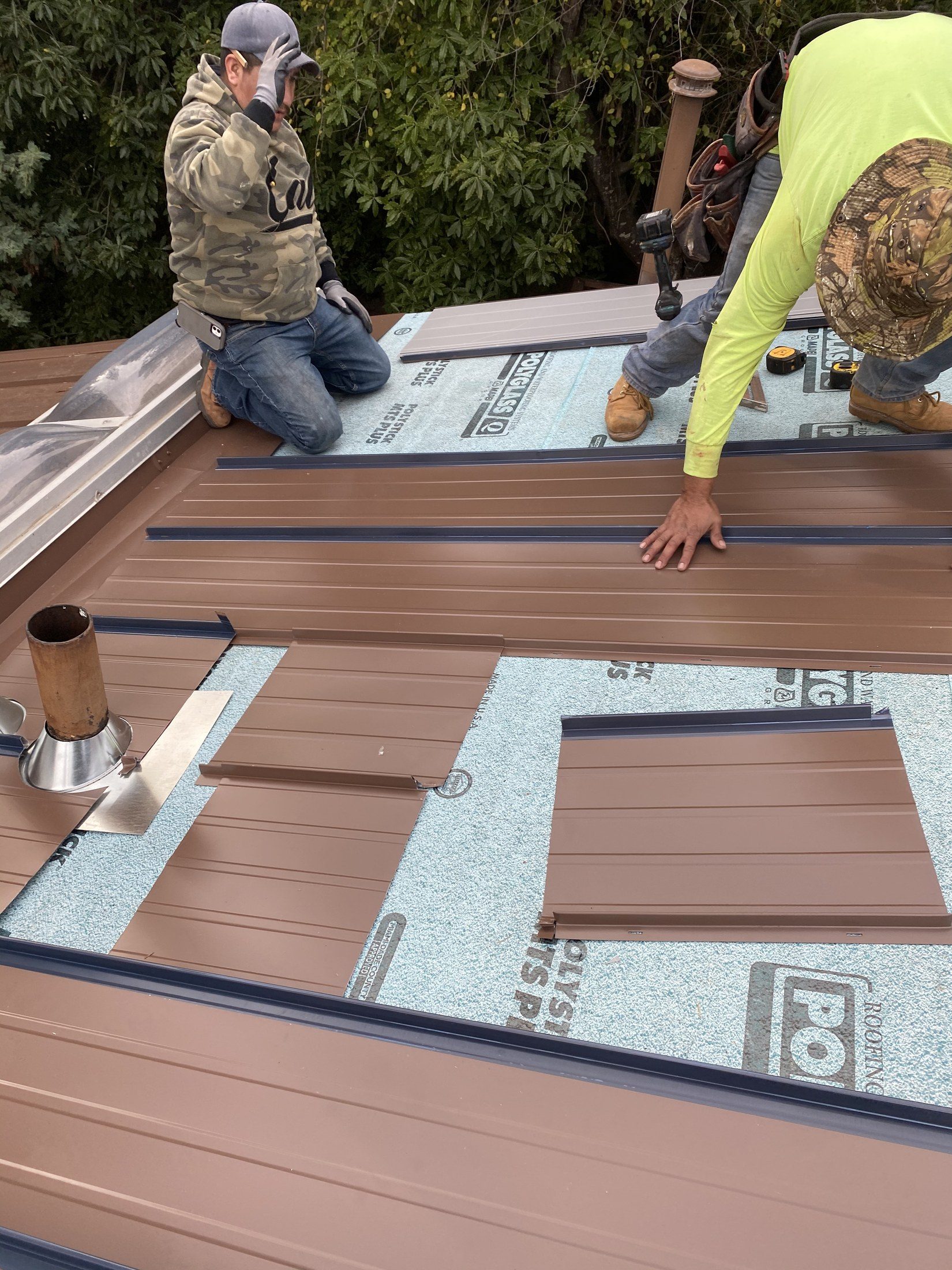 R2L Roofing crew installing a standing-seam metal roof